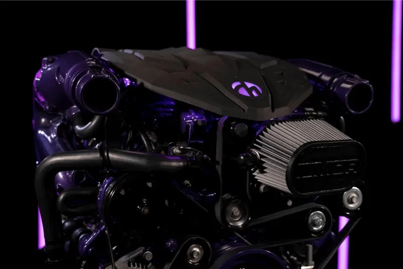 Slide: The Image of 2023 MasterCraft XStar S Piranha engine close-up with purple accents. - 9