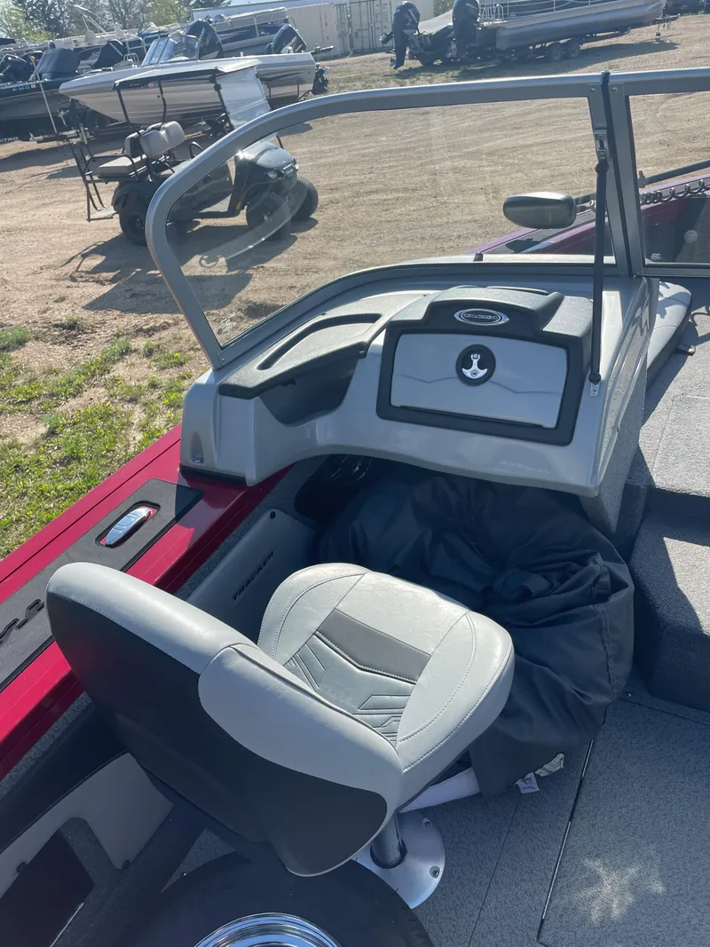 Slide: The Image of 2019 Tracker Targa 19 Combo boat interior with captain's chair and dashboard. - 8