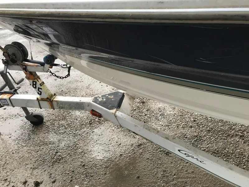 Slide: The Image of 1997 Bayliner 2050 boat on a trailer, side view. - 16