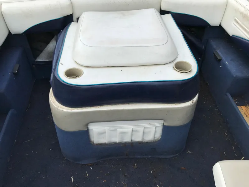 Slide: The Image of 1997 Bayliner 2050 boat interior seating with cup holders. - 25