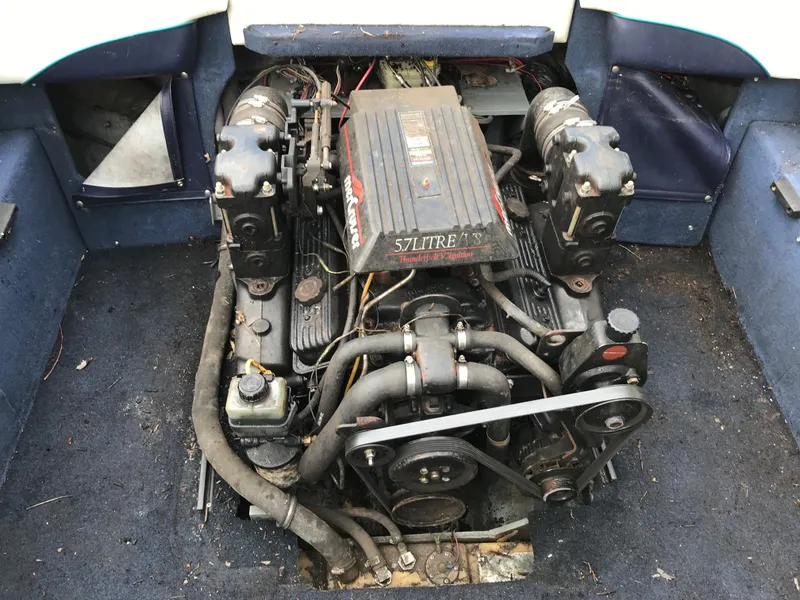 Slide: The Image of 1997 Bayliner 2050 boat engine compartment with 5.7L V8 engine. - 27