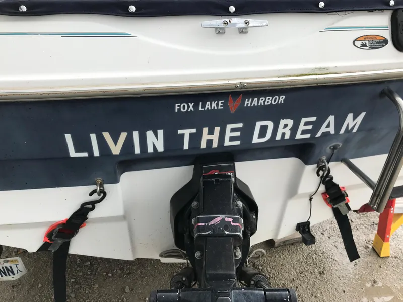 Slide: The Image of 1997 Bayliner 2050 boat with Livin the Dream text at Fox Lake Harbor. - 3