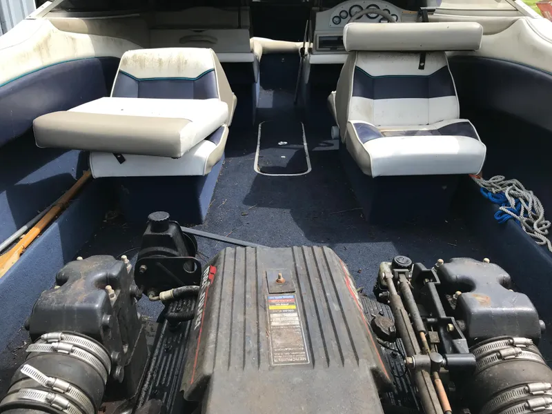 Slide: The Image of Interior of a 1997 Bayliner 2050 boat showing seats and engine. - 36