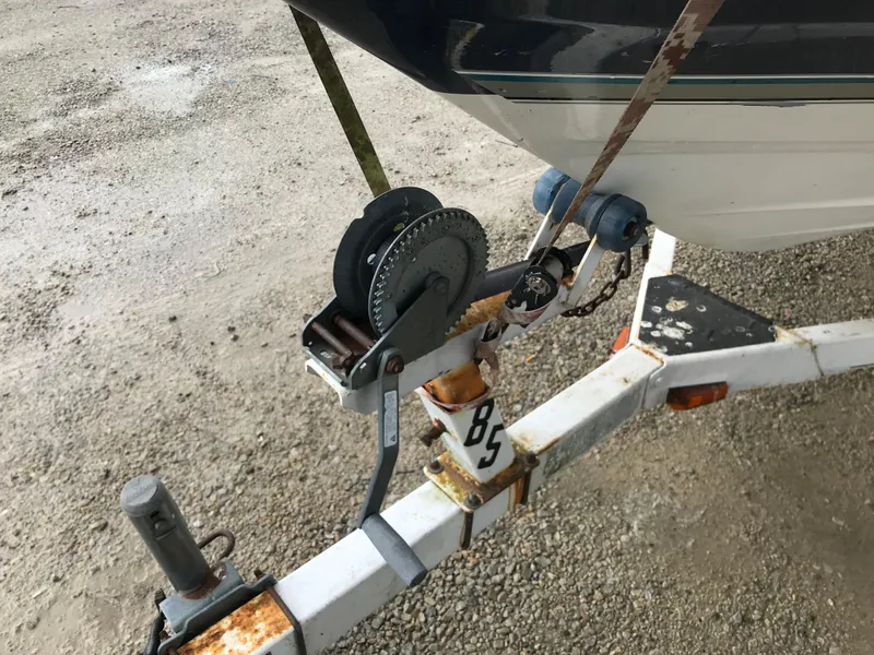 Slide: The Image of Close-up of a 1997 Bayliner 2050 boat trailer winch system. - 8