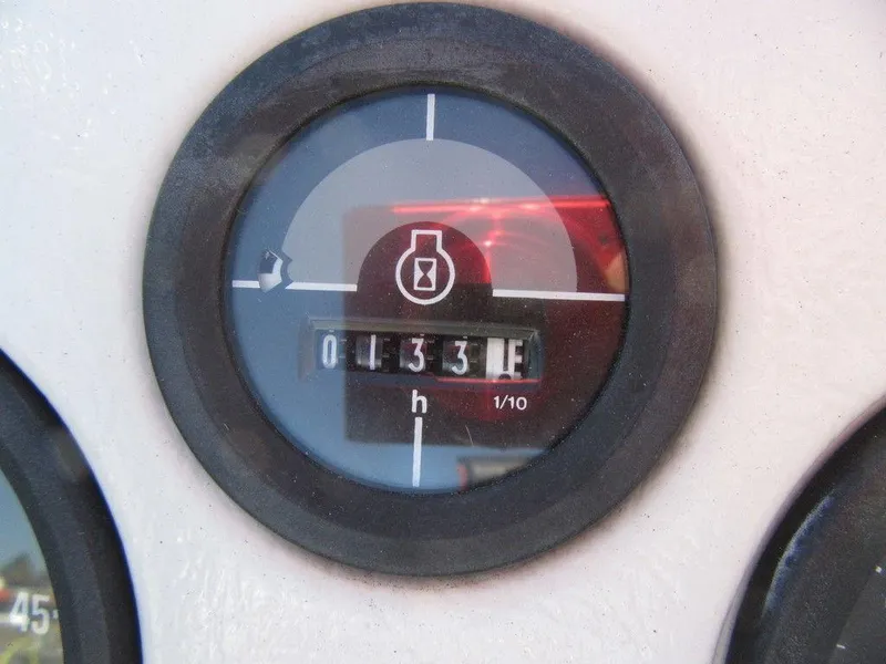 Slide: The Image of Hour meter on a 1994 Lowe 1605 SC boat showing 133.1 hours. - 7