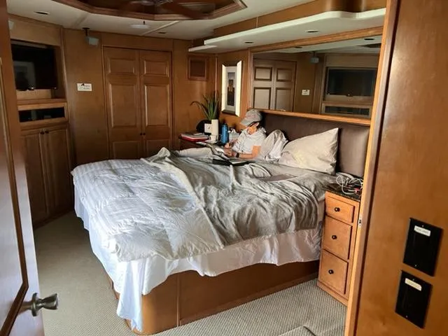 Slide: The Image of Luxurious 2007 Sumerset Fellowship Share #5 bedroom with wood paneling and cozy bedding. - 2