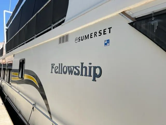 Slide: The Image of 2007 Sumerset Fellowship Share #5 houseboat with sleek design and branding. - 6