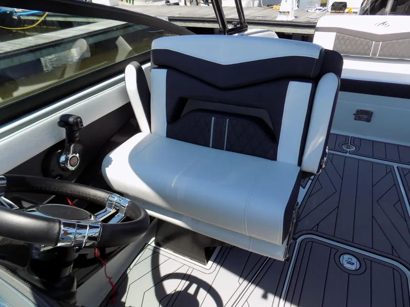 Slide: The Image of 2021 Monterey 255 Super Sport boat interior with sleek black and white seating. - 11