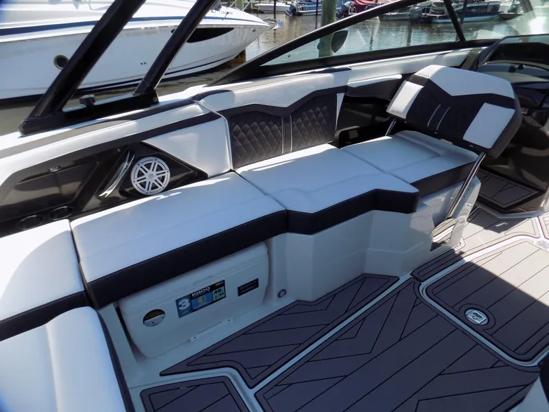 Slide: The Image of 2021 Monterey 255 Super Sport boat interior with sleek seating and modern design. - 12