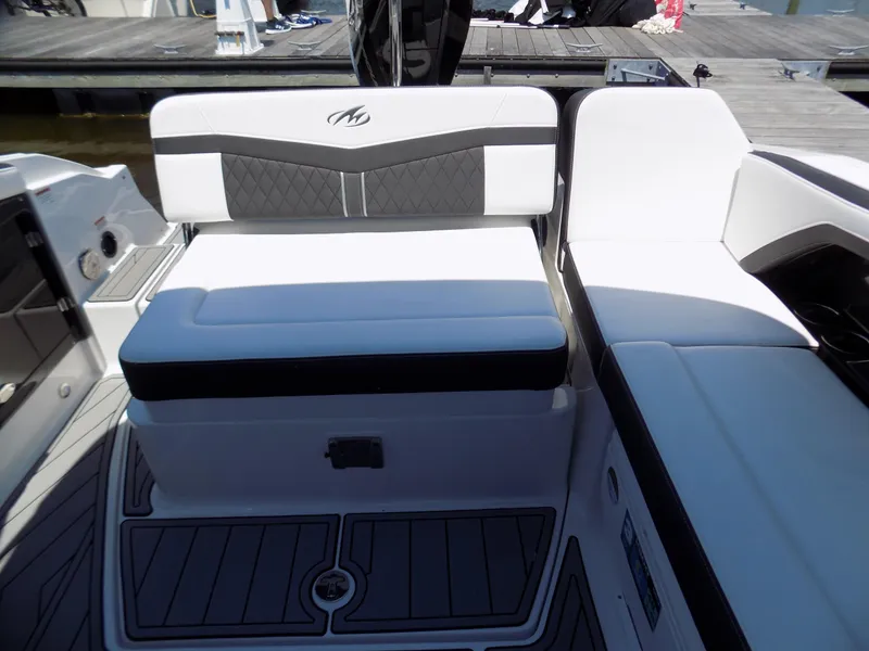 Slide: The Image of 2021 Monterey 255 Super Sport boat interior with cushioned seating and sleek design. - 13