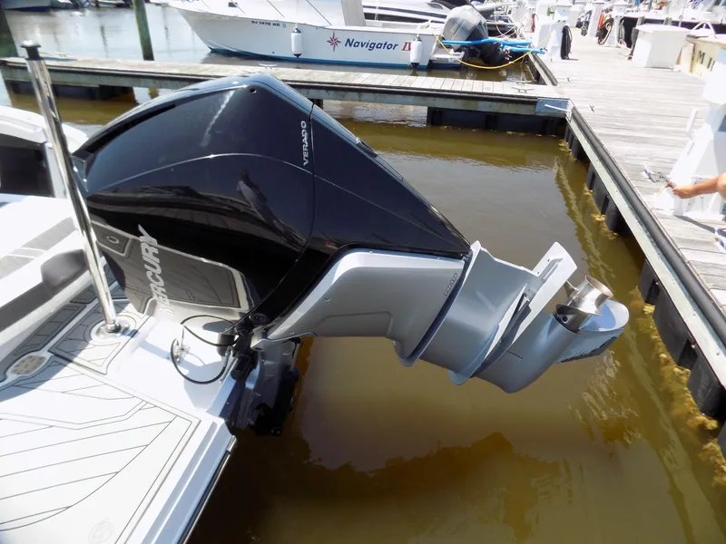 Slide: The Image of 2021 Monterey 255 Super Sport boat with Mercury outboard engine at dock. - 17