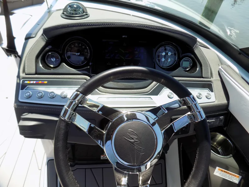 Slide: The Image of 2021 Monterey 255 Super Sport dashboard with modern steering wheel and instrument panel. - 7