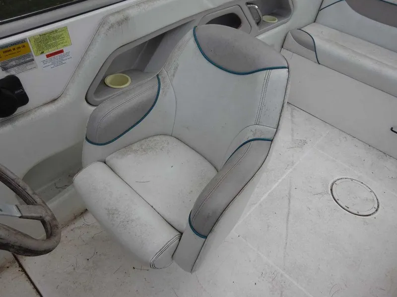 Slide: The Image of 1996 Wellcraft 2400S ECLIPSE boat interior with white and gray seating. - 10