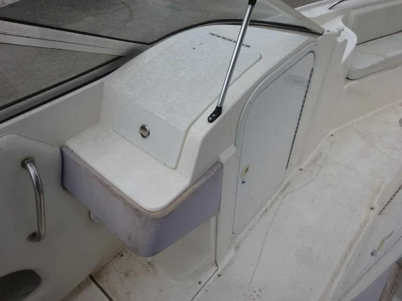 Slide: The Image of 1996 Wellcraft 2400S Eclipse boat interior, showing storage compartments and seating area. - 16