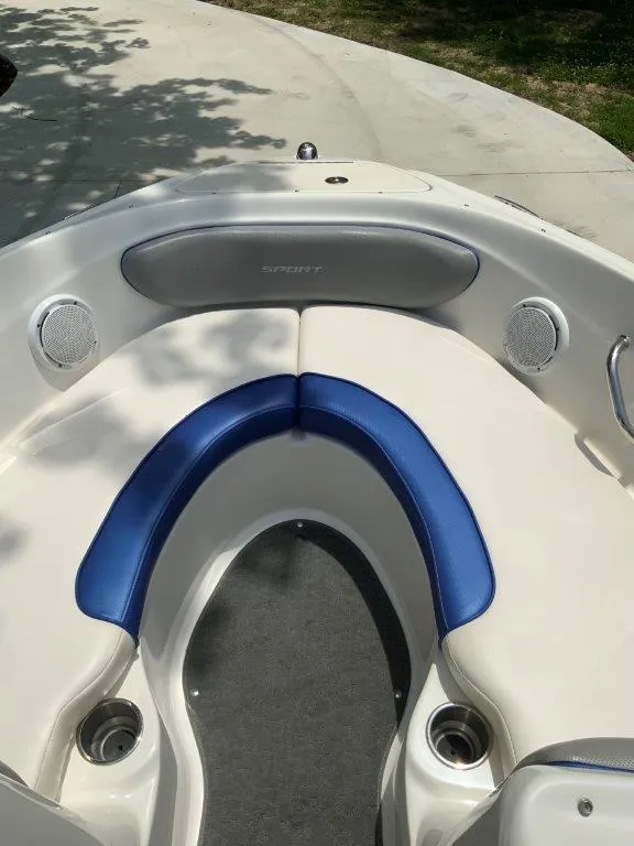 Slide: The Image of 2012 Sea Ray 205 Sport boat interior with blue and white seating. - 7