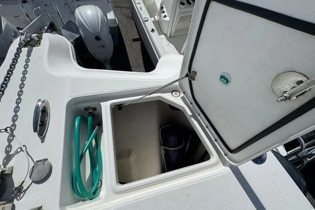 Slide: The Image of Open storage compartment on 2019 World Cat 320 DC boat deck. - 18