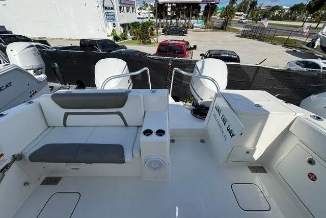 Slide: The Image of 2019 World Cat 320 DC boat interior with seating and storage compartments. - 22