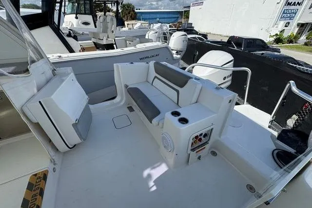 Slide: The Image of 2019 World Cat 320 DC boat interior with seating and control panel. - 24