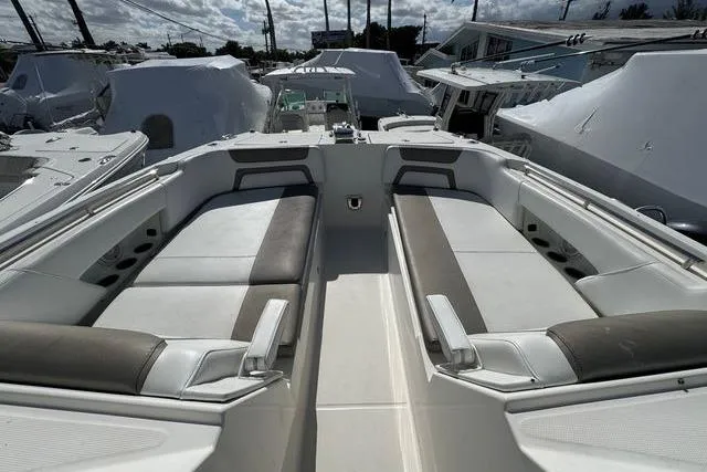 Slide: The Image of 2019 World Cat 320 DC boat interior with spacious seating and modern design. - 26