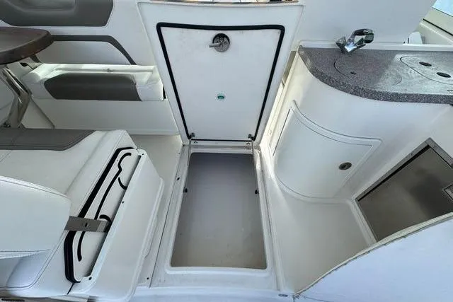Slide: The Image of 2019 World Cat 320 DC interior with storage compartment and seating area. - 37
