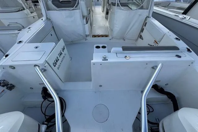 Slide: The Image of 2019 World Cat 320 DC boat interior with seating and storage compartments. - 38