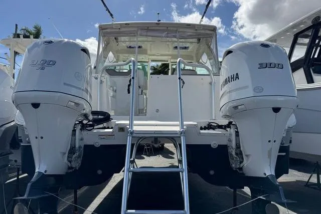 Slide: The Image of 2019 World Cat 320 DC boat with twin Yamaha 300 engines, rear view. - 42