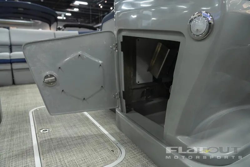 Slide: The Image of 2022 South Bay 525 RS 3.0 Arch 250HP boat storage compartment open. - 22