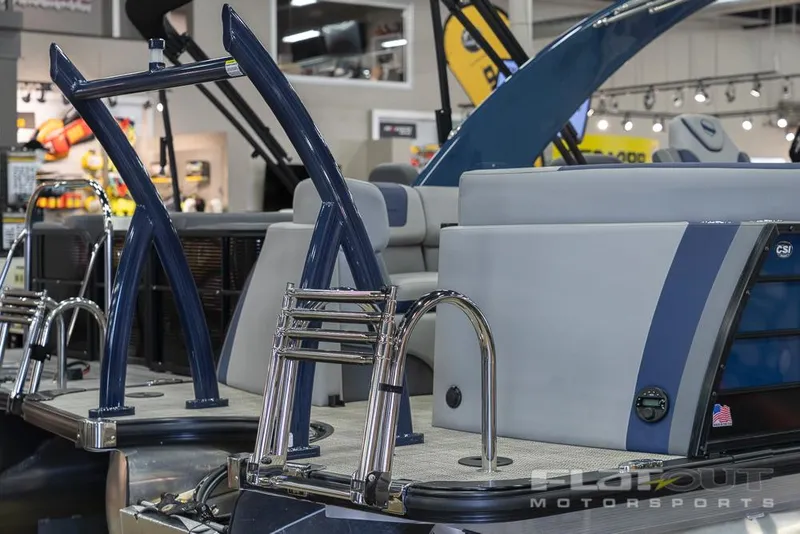 Slide: The Image of 2022 South Bay 525 RS 3.0 Arch 250HP pontoon boat on display indoors. - 33