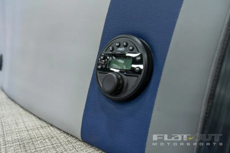 Slide: The Image of Close-up of 2022 South Bay 525 RS 3.0 Arch 250HP boat's audio control panel. - 34