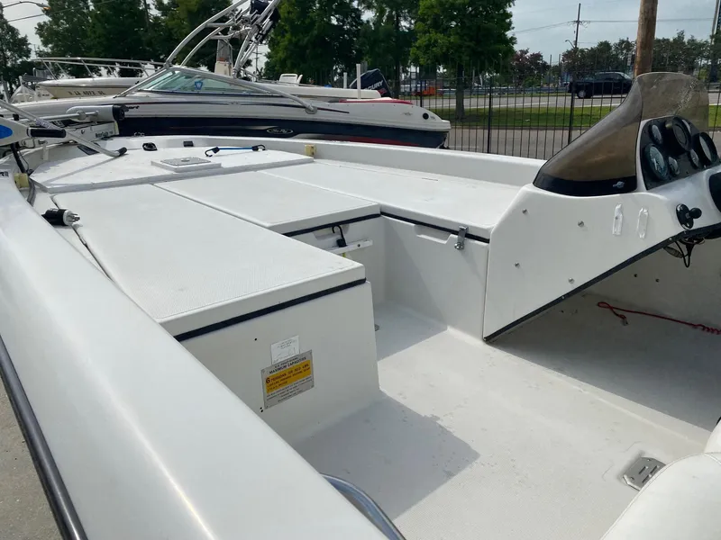 Slide: The Image of 1996 Champion 186 SC boat interior with seating and control panel. - 2