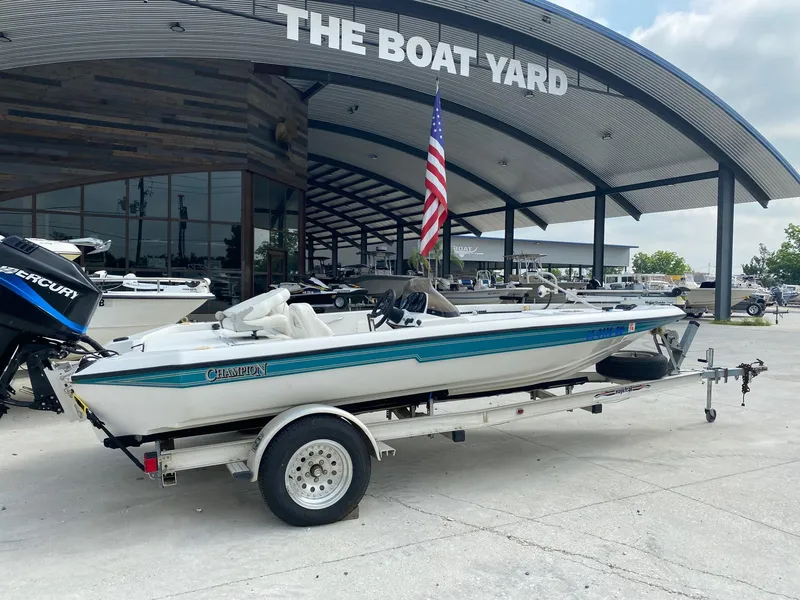 Slide: The Image of 1996 Champion 186 SC boat on trailer at The Boat Yard dealership. - 3