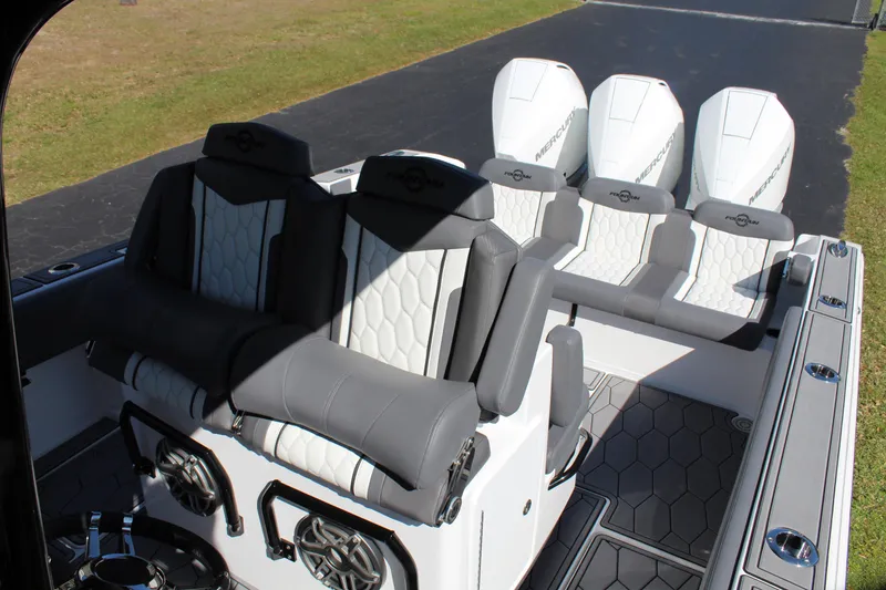 Slide: The Image of 2023 Fountain 34 SC boat interior with luxurious seating and modern design. - 17