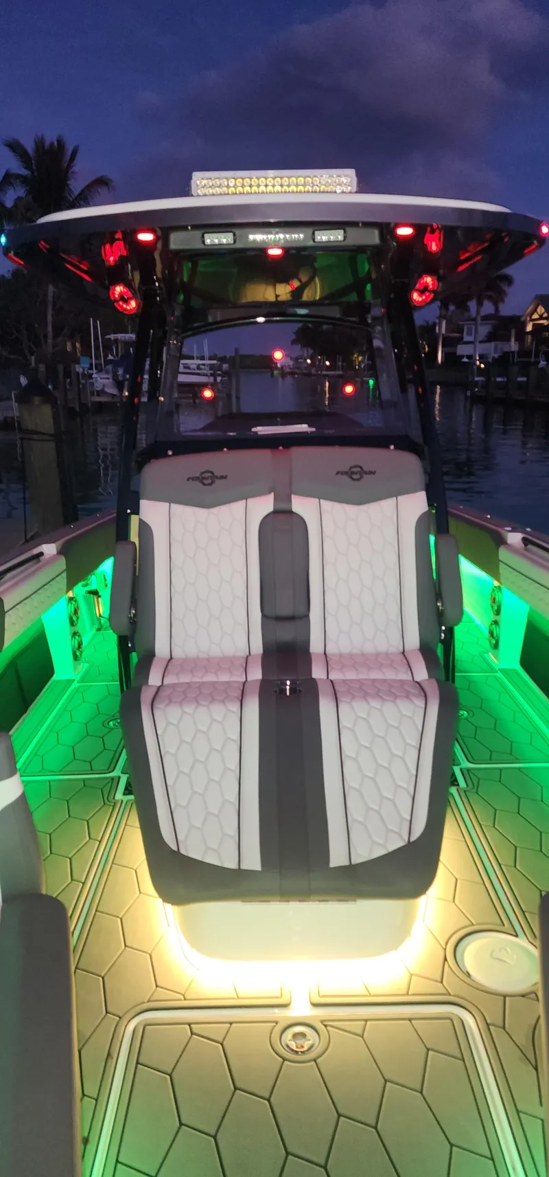 Slide: The Image of 2023 Fountain 34 SC boat with illuminated deck at night. - 24