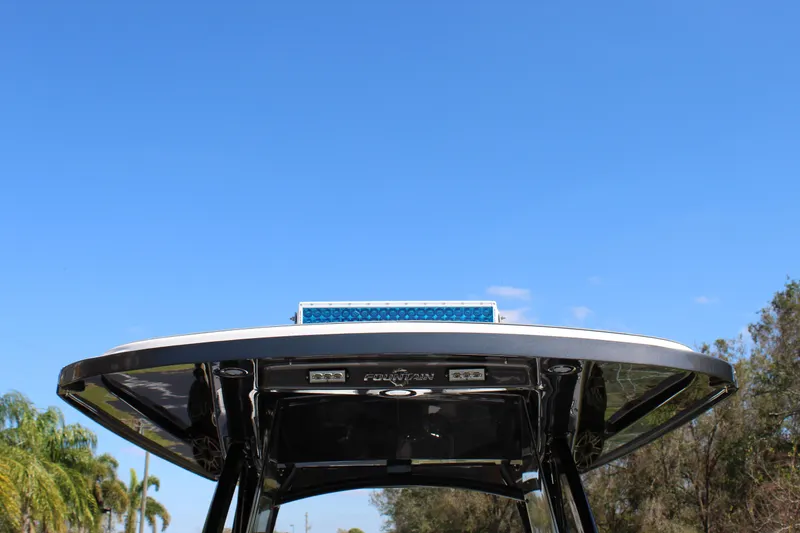 Slide: The Image of 2023 Fountain 34 SC boat top view against clear blue sky. - 9
