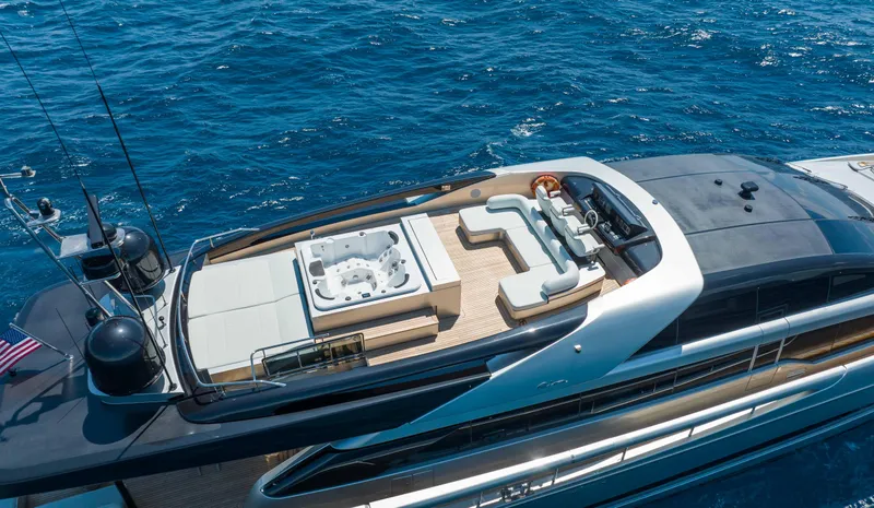 Slide: The Image of Luxurious 2014 Riva Mythos Motoryacht with spacious deck and jacuzzi, cruising on blue ocean waters. - 11