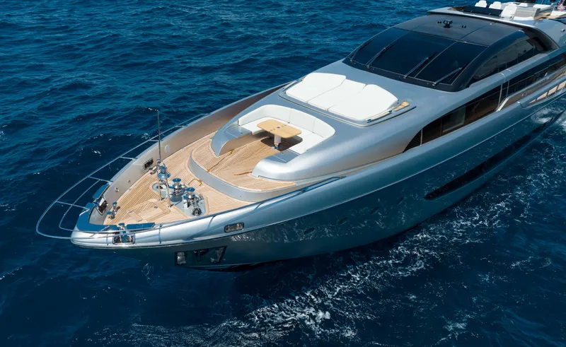 Slide: The Image of 2014 Riva Mythos Motoryacht cruising on open blue sea, showcasing sleek design and luxury. - 13