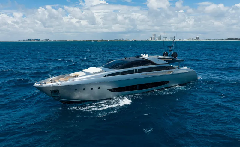 Slide: The Image of Riva Mythos Motoryacht 2014 cruising on open sea under a partly cloudy sky. - 14