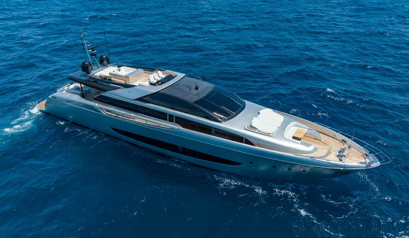 Slide: The Image of Luxurious 2014 Riva Mythos Motoryacht cruising on open blue sea. - 16
