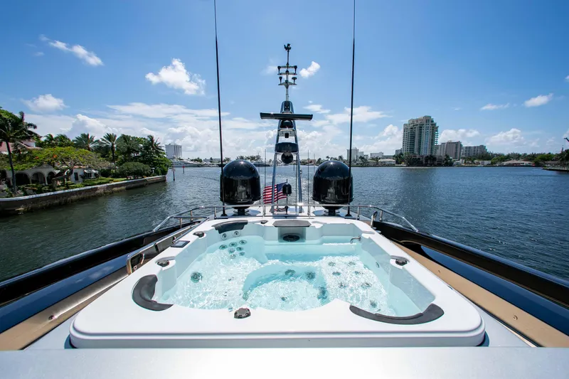 Slide: The Image of Luxurious 2014 Riva Mythos Motoryacht with jacuzzi, overlooking scenic waterfront and city skyline. - 21