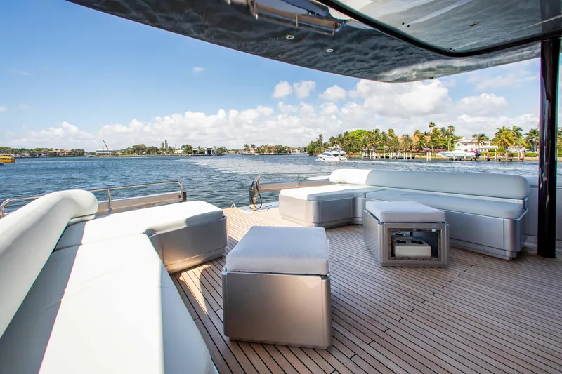 Slide: The Image of Luxurious deck of 2014 Riva Mythos Motoryacht with modern seating and scenic water view. - 39