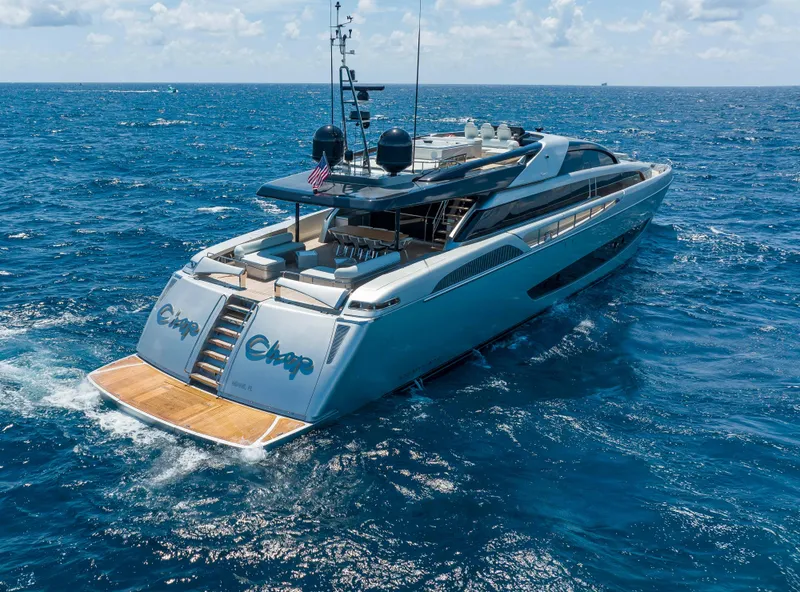 Slide: The Image of Luxurious 2014 Riva Mythos Motoryacht cruising on open blue sea. - 5