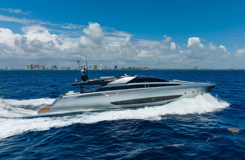 Slide: The Image of 2014 Riva Mythos Motoryacht cruising on open sea under a clear blue sky. - 8