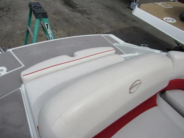 Slide: The Image of 2016 Crownline 255 SS boat interior with white and red seating. - 10