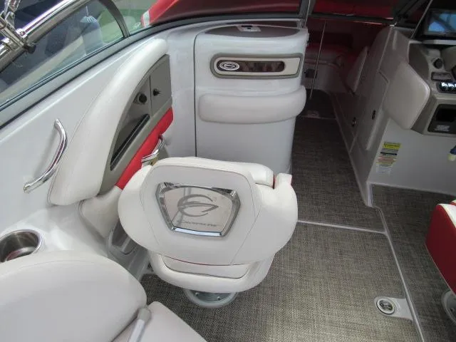 Slide: The Image of Interior of a 2016 Crownline 255 SS boat with white and red seating. - 12