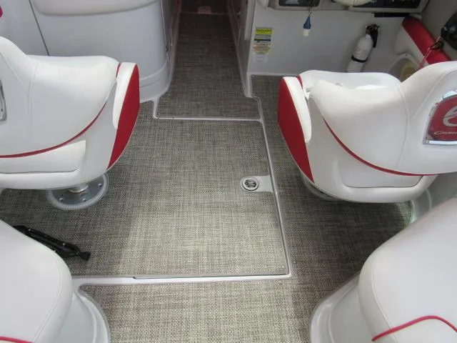 Slide: The Image of Interior of a 2016 Crownline 255 SS boat with white and red seats. - 13