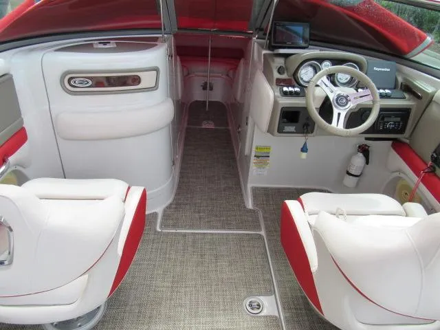 Slide: The Image of Interior of a 2016 Crownline 255 SS boat with red and white seating. - 14