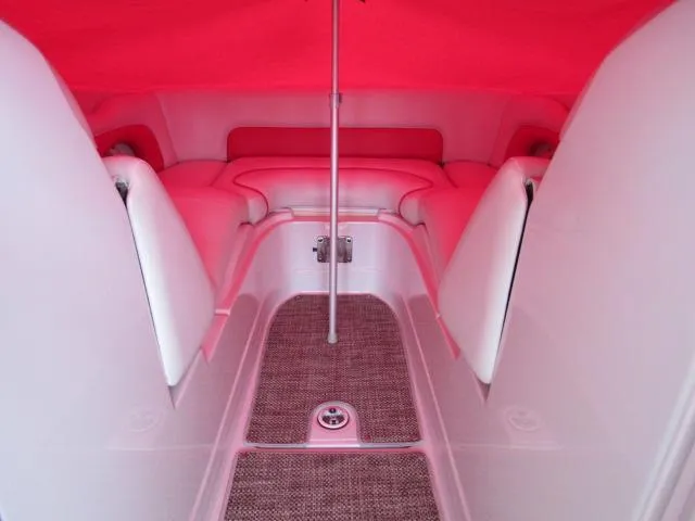 Slide: The Image of Interior of 2016 Crownline 255 SS boat with red canopy and seating area. - 16