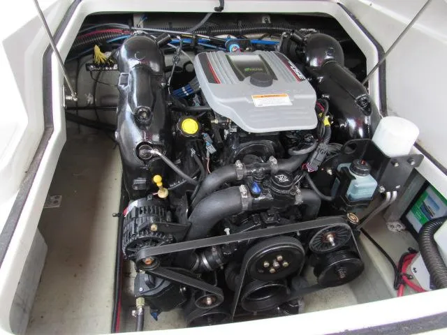 Slide: The Image of 2016 Crownline 255 SS engine compartment with visible components. - 18