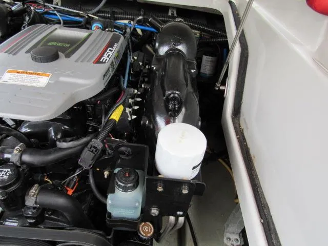 Slide: The Image of 2016 Crownline 255 SS boat engine compartment with 350 HP engine. - 21