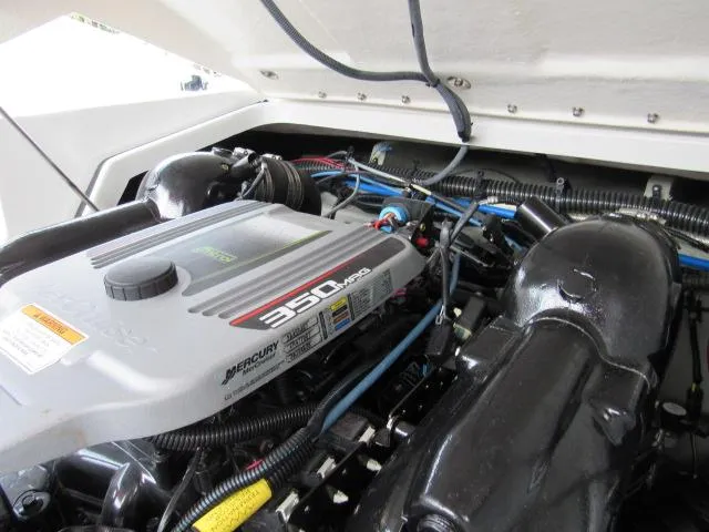 Slide: The Image of 2016 Crownline 255 SS boat engine compartment with Mercury 350 MAG engine. - 23